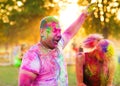 Guys with a girl celebrate holi festival Royalty Free Stock Photo