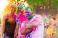 Guys with a girl celebrate holi festival Royalty Free Stock Photo