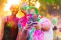 Guys with a girl celebrate holi festival Royalty Free Stock Photo