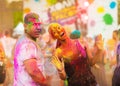 Guys with a girl celebrate holi festival Royalty Free Stock Photo