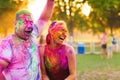 Guys with a girl celebrate holi festival Royalty Free Stock Photo