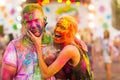 Guys with a girl celebrate holi festival Royalty Free Stock Photo