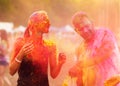 Guys with a girl celebrate holi festival Royalty Free Stock Photo