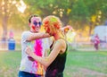 Guys with a girl celebrate holi festival Royalty Free Stock Photo