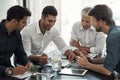 These guys know their business. a group of businessmen having a meeting around a table in an office. Royalty Free Stock Photo