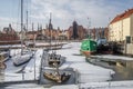 Winter and waterfront of Old Town in Gdansk, Poland, with sunk boat wreck