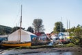 Tourists and locals enjoy the Boatyard Cafe on the creek, in the picturesque village of Gweek in Corwall