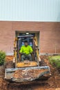 A man operates industrial equipment