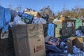 Overflowing dumpsters at a rural public dump after Christman