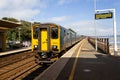 A GWR train arrives at Dawlish railway station in Devon Royalty Free Stock Photo