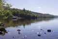 A small fishing boat moored in a remote bay Royalty Free Stock Photo