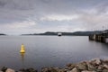 A ferry approaching a port on the coast of Scotland on a cold summers day. Royalty Free Stock Photo