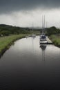 Sail boats in Crinan canal on a rainy day. Royalty Free Stock Photo