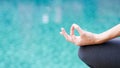 Gyan mudra hand yoga calm peace blue water background Royalty Free Stock Photo
