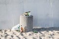 Gydnia, Poland- 09 May 2020; Garbage on the beach in an overfilled bin. The concept of people littering the environment