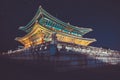 Gyeongbokgung main palace at night with writing in chinese meaning -