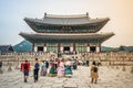 Gyeongbokgung palace main throne hall aka Geunjeongjeon view with tourists in Hanbok traditional dressing in Seoul South Korea