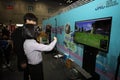 Gyeonggi-do,South Korea-March 2019: Korean woman playing a 3D virtual reality game with glasses on a screen