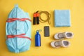 Gym bag, smartphone and sports equipment on background, flat lay Royalty Free Stock Photo