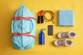 Gym bag, smartphone and sports equipment on background, flat lay Royalty Free Stock Photo