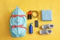 Gym bag, smartphone and sports equipment on background, flat lay Royalty Free Stock Photo