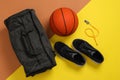 Gym bag and sports equipment on color background, flat lay Royalty Free Stock Photo