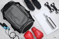 Gym bag and sports equipment on white background, flat lay Royalty Free Stock Photo