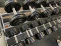 Gym for bodybuilding. Heavy dumbbells and exercise equipment. Barbells and equipment for athletes