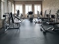 Gym for bodybuilding. Heavy dumbbells and exercise equipment. Barbells and equipment for athletes