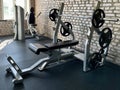 Gym for bodybuilding. Heavy dumbbells and exercise equipment. Barbells and equipment for athletes