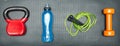 Gym concept. dumbbell, skipping rope,training weight and energy drink on step equipment background.Healthy lifeslile