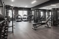 gym with different types of fitness equipment, including dumbbells, barbells, and machines