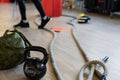 Gym equipment for boot camp and work out. Kettle Bell, Rope, Sandbag in gym hall Royalty Free Stock Photo