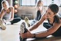 Gym, exercise and women stretching, workout and training for wellness, healthy lifestyle and balance. Female people Royalty Free Stock Photo