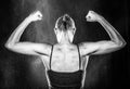 Gym Fit Woman Showing her Arm and Back Muscles Royalty Free Stock Photo