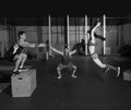 Gym group workout barbells slam balls and jump