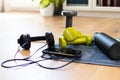 Gym at home, accessories for fitness at home. Tools for sport activities: towel, headphone, mobile phone, dumbbell and water tank