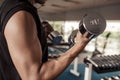 Gym man lifting heavy free weights Royalty Free Stock Photo