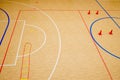 Gym for playing futsal, mini-football. Folded wooden parquet on the field of hall for mini-football. Futsal ball and bright line Royalty Free Stock Photo