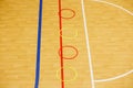 Gym for playing futsal, mini-football. Folded wooden parquet on the field of hall for mini-football. Futsal ball and bright line Royalty Free Stock Photo