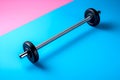 Gym rod or fitness rod on colored background. Metal barbell with black disks isolated on pink blue background. Pro sport equipment