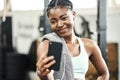 A gym selfie for social media. an attractive young woman standing alone in the gym and taking selfies with her cellphone Royalty Free Stock Photo