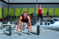 Gym with weight lifting bar workout man and woman Royalty Free Stock Photo