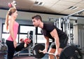 Gym weightlifting couple workout barbell dumbbell Royalty Free Stock Photo