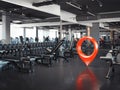 Gym with white walls and dark floor with red geotag, 3d rendering