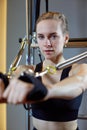 Gym woman pilates stretching sport in reformer bed instructor girl. Selective focus on hands Royalty Free Stock Photo