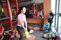 Gym woman in gym working out using kettlebells indoor. Beautiful, press. Royalty Free Stock Photo
