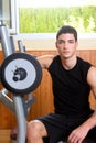 Gym young man posing bodybuilding weigths Royalty Free Stock Photo