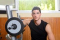 Gym young man posing bodybuilding weigths Royalty Free Stock Photo