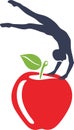 Gymnast balancing on an apple. Symbol for design